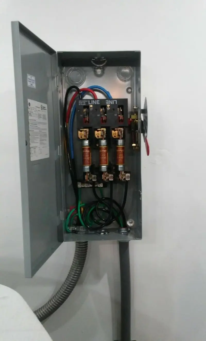 Three-phase disconnect switch installed for Smoke Detector Installation in Osage